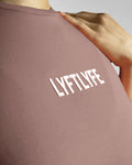 Close-up of Lyftlyfe’s textured 3D logo on the Contour Oversized Tee in rose color, designed for a premium aesthetic.