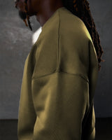 Side view of the men’s green Adapt Crew, highlighting clean stitching details and ultra-plush fleece material.