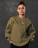 Front-facing women’s green oversized crewneck with a stylish 3D Lyftlyfe chest logo and premium plush fleece.