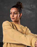 Close-up side shot of women’s yellow oversized Adapt Crew highlighting premium craftsmanship with clean stitching and ultra-soft fleece.