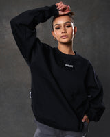Women’s ultra-soft black crewneck sweater with lightweight fleece fabric, ribbed details, and Lyftlyfe logo.
