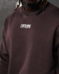 Close-up of Lyftlyfe Adapt Crew in dark brown with a LYFTLYFE white logo on the chest. 
