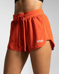 Left side view of cherry red LYFTLYFE shorts showcasing motion-ready design.