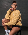 Women’s ultra-soft yellow crewneck sweater with lightweight fleece fabric, ribbed details, and Lyftlyfe logo.