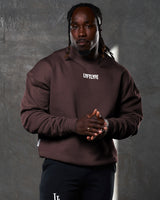 Men’s fleece crewneck in dark brown with a clean, oversized design, ribbed hems, and a rubberized Lyftlyfe chest logo.