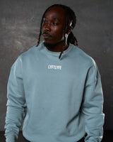 Men’s oversized light blue crewneck sweater with ultra-plush fleece fabric and 3D rubberized Lyftlyfe logo on the chest.