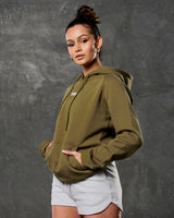 LYFTLYFE women’s pine green hoodie with pocket detail from the side angle.