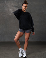 Women’s ultra-soft black crewneck sweater with lightweight fleece fabric, ribbed details, and a white Lyftlyfe logo.