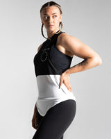 Side view of Women's two-panel sleeveless shirt, black and white, featuring wide arm openings, anti-odor technology, and a Lyftlyfe logo on the left chest.