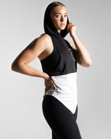 Right side view of Women’s sleeveless hoodie with two-tone black and white panels, made from performance fabric. 