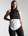 Women’s sleeveless hoodie with two-tone black and white panels, made from tri-blend polyester and elastane fabric with anti-odor capabilities. 