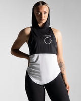 Women’s sleeveless hoodie with two-tone black and white panels, made from tri-blend polyester and elastane fabric with anti-odor capabilities. 
