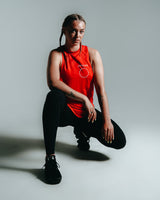 Women’s sleeveless tank top in red with Lyftlyfe branding and circle star detail, designed for comfort and performance. 