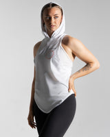 Left side view of Women’s athletic hooded tank top in white, highlighting anti-odor stretch materials and lightweight design.
