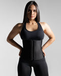 Woman wearing LYFTLYFE waist trainer, front view with hands on hips.