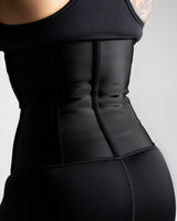 Full back shot of sleek, contoured waist trainer fit.