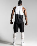 Back view of Men’s sleeveless shirt with two panels, white on top and black at the bottom, made with tri-blend fabric for performance and sweat-wicking.