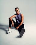Women’s Dominance tank top in purple, showcasing wrinkle-resistant, lightweight fabric for gym wear.