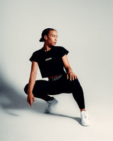 Women’s cropped Drill T-shirt in black, featuring a regular fit, moisture-wicking cotton blend, and a 3D rubberized Lyftlyfe logo.