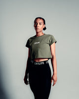 Perfectly cropped Drill Women’s Tee in olive green, featuring a soft crew neckline and breathable moisture-wicking cotton blend.