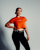 Women’s cropped Drill T-shirt in red, featuring a regular fit, moisture-wicking cotton blend, and a white Lyftlyfe logo.