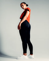 Side angle of the red Drill Women’s Crop Tee, designed for unrestricted movement with a cooling and second-skin feel.