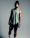 Front view of the Men’s Dominance Sleeveless Hoodie tank in green, showcasing its hood, streamlined fit, and performance fabric.