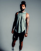 Front view of the Men’s Dominance Sleeveless Hoodie tank in green, showcasing its hood, streamlined fit, and performance fabric.