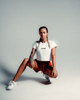 Perfectly cropped Drill Women’s Tee in white, featuring a soft crew neckline and breathable moisture-wicking cotton blend.