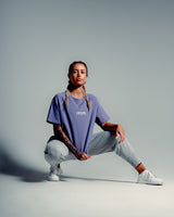 Relaxed-fit Contour Women’s Oversized Tee in purple, offering cooling properties, premium stitching, and all-day breathability.