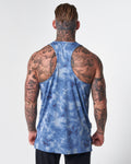 Athletic back shown wearing lightweight gym stringer in blue sponge print. 