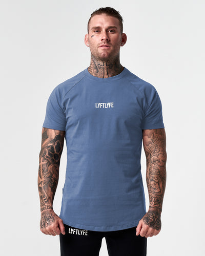Blue LYFTLYFE contour t-shirt with white logo on light grey. 