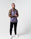 Athlete wearing LYFTLYFE’s purple haze gym stringer full-body.