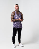 Athlete wearing LYFTLYFE’s purple haze gym stringer full-body.