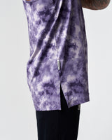 Zoomed detail of flag tag and reinforced side split on purple men's gym stringer. 