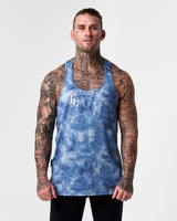Athletic build showcased in blue sponge print gym stringer from LYFTLYFE.