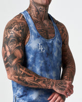 Embroidered white LYFTLYFE logo detail on blue sponge print stringer tank.