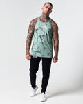 Full body view of green marble print men's tank with black joggers.