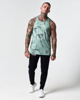 Full body view of green marble print men's tank with black joggers.