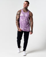 Full body view of light purple marble print men's tank with black joggers.