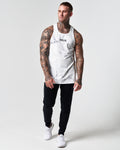 Men's white marble gym tank paired with LYFTLYFE performance pants.