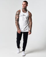 Men's white marble gym tank paired with LYFTLYFE performance pants.
