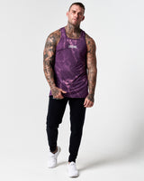 Full body view of dark purple marble print men's tank with black joggers.
