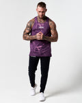 Head-to-toe shot of model wearing dark purple marble gym tank.