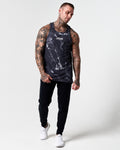 Men's gym tank in black marble print paired with LYFTLYFE performance joggers.