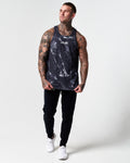 Full body view of black marble print men's tank with black joggers.