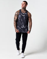 Full body view of black marble print men's tank with black joggers.