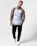 Full body view of blue marble print men's tank with black joggers.