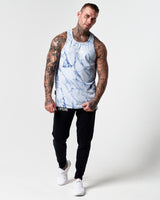 Full body view of blue marble print men's tank with black joggers.