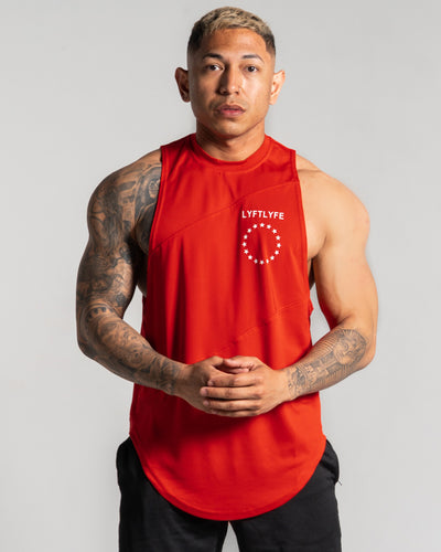 Mens tank top in red with a white logo on the left chest.
